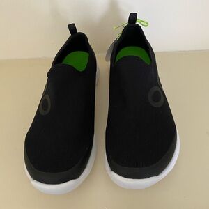 Oofos slip on sneakers.